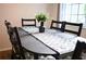 Dining area with black table and chairs, stylish decor at 605 Oakpoint Cir, Davenport, FL 33837