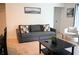 Bright living room featuring a comfortable sofa and coffee table at 605 Oakpoint Cir, Davenport, FL 33837