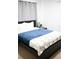 Comfortable bedroom with a queen-size bed and stylish decor at 605 Oakpoint Cir, Davenport, FL 33837