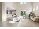 Spacious living room with tile flooring, large windows and neutral colors at 400 Harbor Winds Ct, Winter Springs, FL 32708
