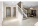 Bright entryway with tile floors and a staircase leading upstairs at 400 Harbor Winds Ct, Winter Springs, FL 32708
