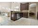 Kitchen with dark wood cabinets and granite countertops at 400 Harbor Winds Ct, Winter Springs, FL 32708