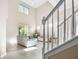 Spacious living room with high ceilings, tile floors, and a staircase at 400 Harbor Winds Ct, Winter Springs, FL 32708