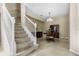 View of carpeted staircase and the dining room at 400 Harbor Winds Ct, Winter Springs, FL 32708