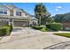 Two-story townhome with a two-car garage and manicured landscaping at 400 Harbor Winds Ct, Winter Springs, FL 32708