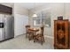 Eat-in kitchen with granite countertops and wood cabinets at 400 Harbor Winds Ct, Winter Springs, FL 32708