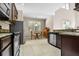 Open kitchen with granite countertops and stainless steel appliances at 400 Harbor Winds Ct, Winter Springs, FL 32708