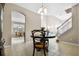 View of dining room from the living room, showing an arched entryway and staircase at 400 Harbor Winds Ct, Winter Springs, FL 32708