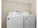 Laundry room with washer and dryer, and overhead shelving at 400 Harbor Winds Ct, Winter Springs, FL 32708