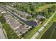 Aerial view of a community with houses, a pool, and lush greenery at 400 Harbor Winds Ct, Winter Springs, FL 32708