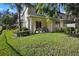 Landscaped backyard with a patio and grassy area at 400 Harbor Winds Ct, Winter Springs, FL 32708