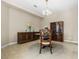 Formal dining room with a round table, wooden buffet, and tile floors at 400 Harbor Winds Ct, Winter Springs, FL 32708
