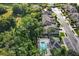 Community pool area with lounge chairs and tropical landscaping at 400 Harbor Winds Ct, Winter Springs, FL 32708