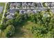 Aerial view showing houses and a large undeveloped green space at 400 Harbor Winds Ct, Winter Springs, FL 32708