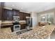 Kitchen boasts stainless steel appliances and granite counters at 400 Harbor Winds Ct, Winter Springs, FL 32708