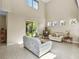 Living room with high ceilings and access to backyard at 400 Harbor Winds Ct, Winter Springs, FL 32708