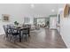 Farmhouse style dining area with black chairs and hardwood floors at 7366 Lazy Hill Dr, Orlando, FL 32818