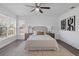 Bright bedroom with king-size bed and neutral decor at 7366 Lazy Hill Dr, Orlando, FL 32818