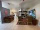 Living room with tile floors, comfortable furniture, and large wall art at 185 Winding Cove Ave, Apopka, FL 32703