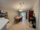 Dining room with a table for six and sliding glass doors at 185 Winding Cove Ave, Apopka, FL 32703