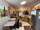 Kitchen with wood cabinets and stainless steel appliances at 185 Winding Cove Ave, Apopka, FL 32703
