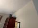 Wall with a wooden wardrobe and various items at 185 Winding Cove Ave, Apopka, FL 32703