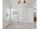 Bedroom with ceiling fan, window, and double doors at 6533 Cartmel Ln, Windermere, FL 34786