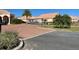 Gated community entrance with landscaping at 2108 Shantiniketan Blvd # B8, Tavares, FL 32778