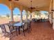 Outdoor patio area with tables and chairs at 2108 Shantiniketan Blvd # B8, Tavares, FL 32778