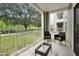 Private patio with two wicker chairs and a small table at 3174 Feltrim Pl # 104, Kissimmee, FL 34747