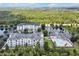 Aerial view of community with multiple buildings and a pool at 3174 Feltrim Pl # 104, Kissimmee, FL 34747