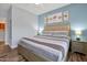 Bright bedroom with a king-size bed and modern nightstands at 3174 Feltrim Pl # 104, Kissimmee, FL 34747