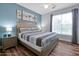 Main bedroom with king bed and light wood floors at 3174 Feltrim Pl # 104, Kissimmee, FL 34747