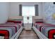 Mickey Mouse-themed bedroom with twin beds at 3174 Feltrim Pl # 104, Kissimmee, FL 34747