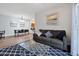 Living room with sofa, coffee table, and view of dining area at 3174 Feltrim Pl # 104, Kissimmee, FL 34747