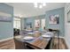 Dining area with table set for six and living room view at 3174 Feltrim Pl # 104, Kissimmee, FL 34747