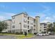 Three-story apartment building with ample parking at 3174 Feltrim Pl # 104, Kissimmee, FL 34747