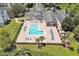 Aerial view of community pool, clubhouse, and parking at 3174 Feltrim Pl # 104, Kissimmee, FL 34747