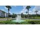 Community entrance with fountain and landscaping at 3174 Feltrim Pl # 104, Kissimmee, FL 34747