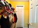 Small closet with hanging clothes and shelves at 4099 Dijon Dr # 4099H, Orlando, FL 32808