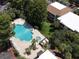Complex aerial view showing pool and buildings at 4099 Dijon Dr # 4099H, Orlando, FL 32808