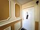 Condo entry with decorative molding and white door at 4099 Dijon Dr # 4099H, Orlando, FL 32808