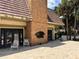 Brick fireplace and patio area with seating at 4099 Dijon Dr # 4099H, Orlando, FL 32808