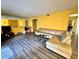 Living room with large sectional sofa and wood-look flooring at 4099 Dijon Dr # 4099H, Orlando, FL 32808