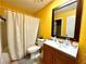 Clean bathroom with a shower/tub combo and vanity at 4099 Dijon Dr # 4099H, Orlando, FL 32808
