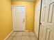 Condo entry with white doors and yellow walls at 4099 Dijon Dr # 4099H, Orlando, FL 32808