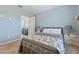 Well-lit bedroom with a double bed and built-in dresser at 3617 Seneca Club Loop # 7-101 A, Orlando, FL 32808