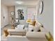 Bright living room with white sectional sofa, coffee table, and decorative wall art at 2787 L B Mcleod Rd # A, Orlando, FL 32805