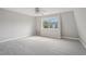 Bright bedroom with carpet flooring and a window offering natural light at 1930 Conway Rd # 6, Orlando, FL 32812