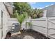 Small, private backyard with a wooden fence and air conditioning unit at 1930 Conway Rd # 6, Orlando, FL 32812